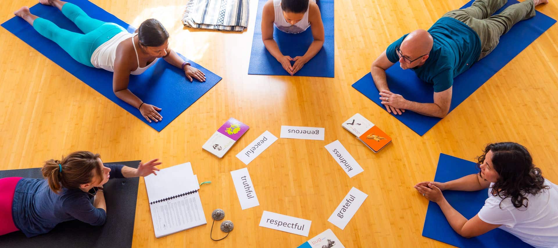 A group of kids yoga teacher trainers