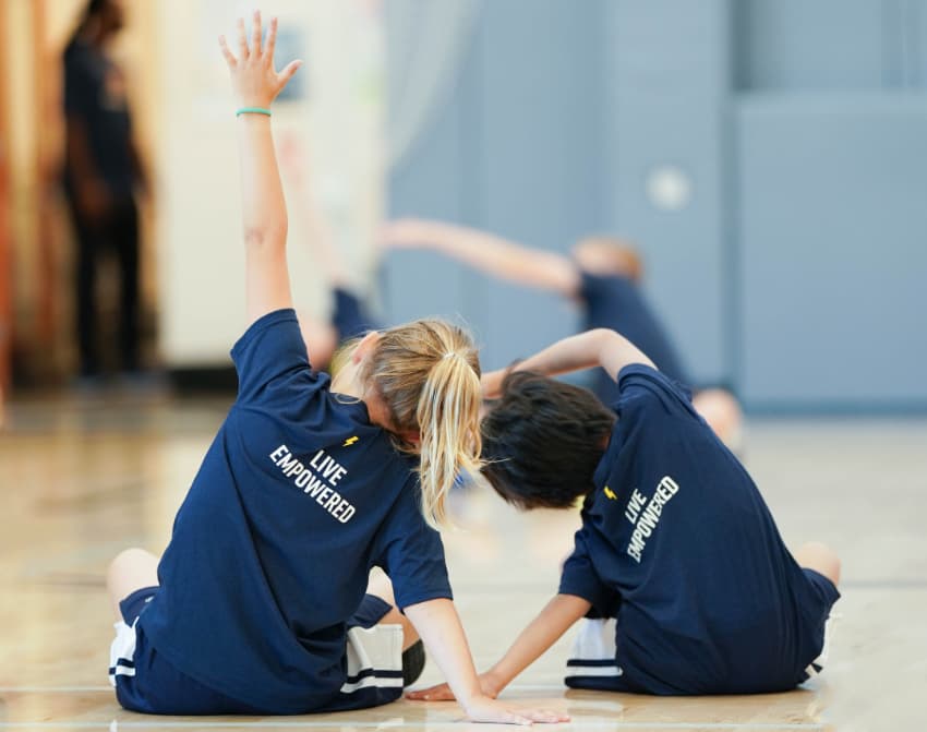 2 Young Athletes doing Yoga.