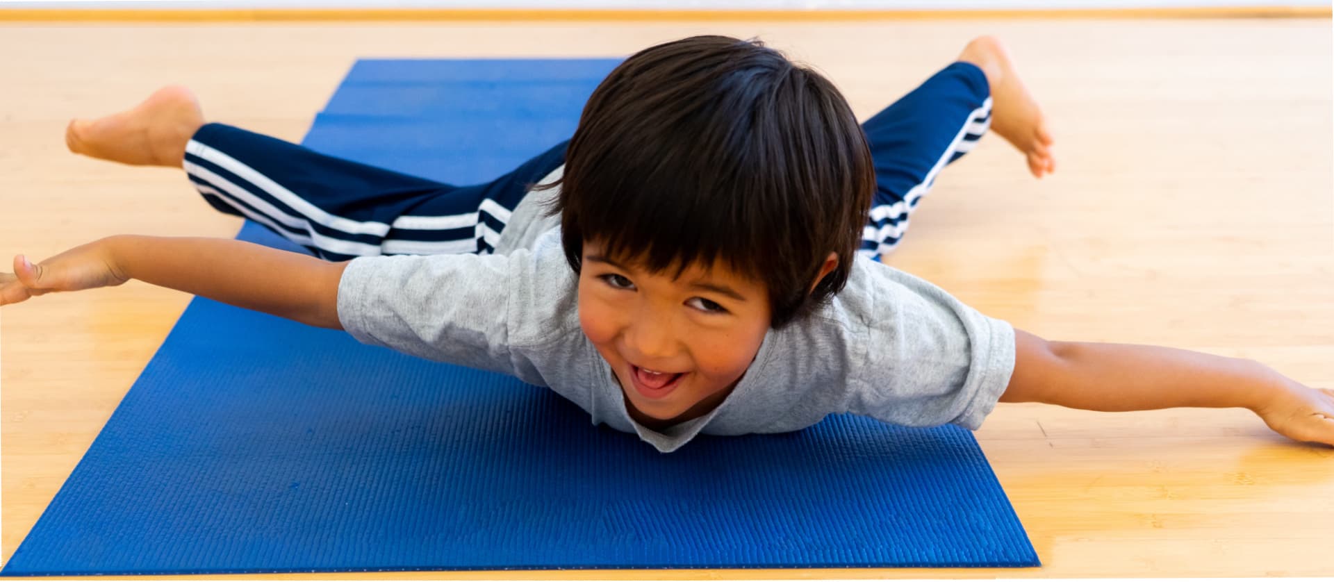 IYK Young Child doing a Flying Pose