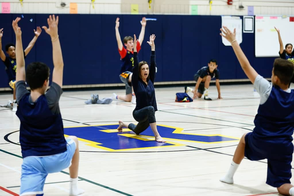 Yoga instruction for youth sports in a gym