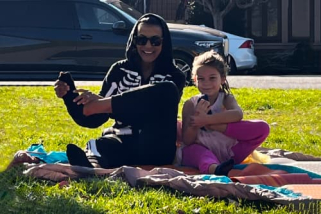 A mom and daughter doing yoga for Halloween